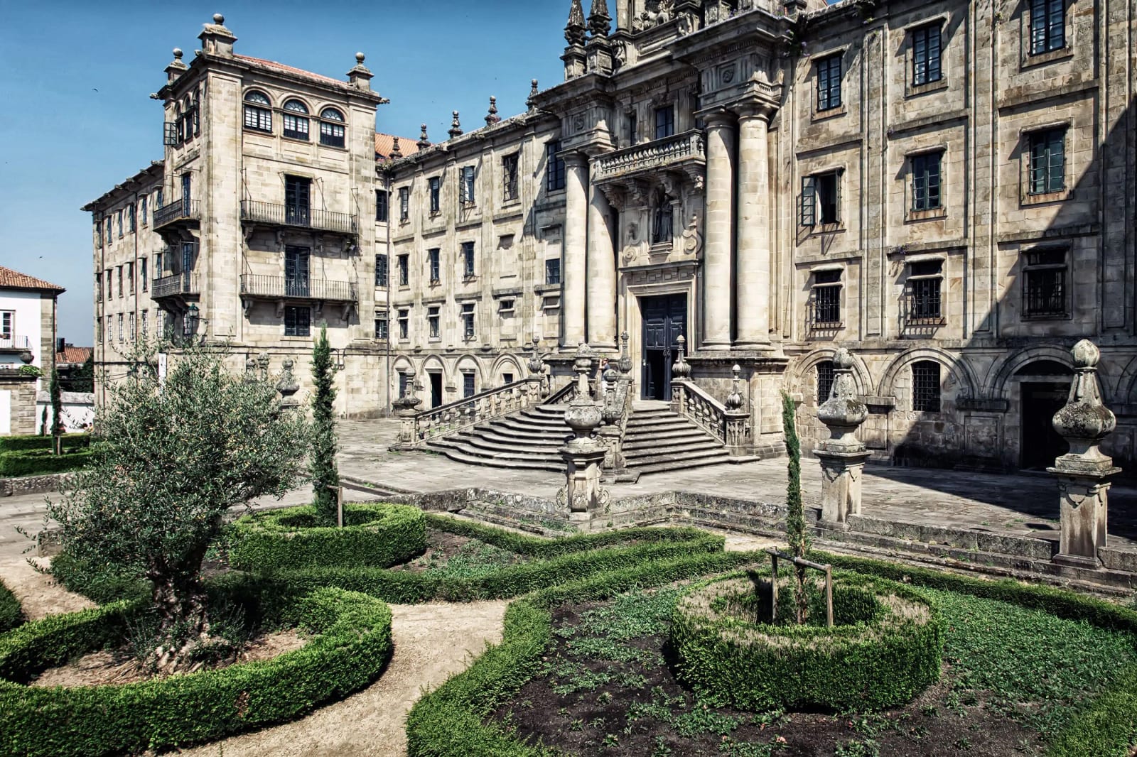 Stone baroque façade and formal garden at the University of Santiago de Compostela